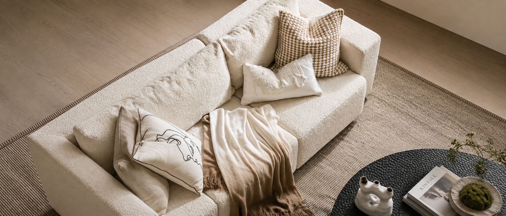 Textured fabrics and soft furnishings arranged together